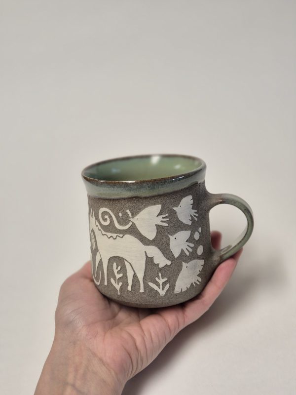 Ceramic sgraffito mug with horses